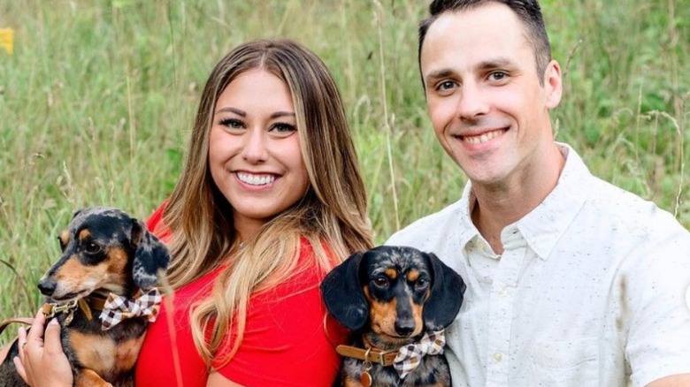 Alaina Mathers and husband holding dachshunds