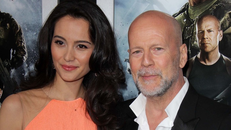 Emma Heming and Bruce Willis posing