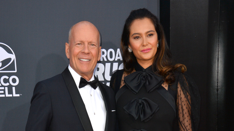 Emma Heming Willis and Bruce Willis smile 