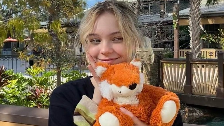 Emma Myers holding a teddy bear