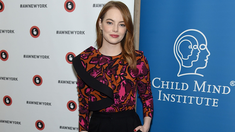 Emma Stone stands at a Child Mind Institute event