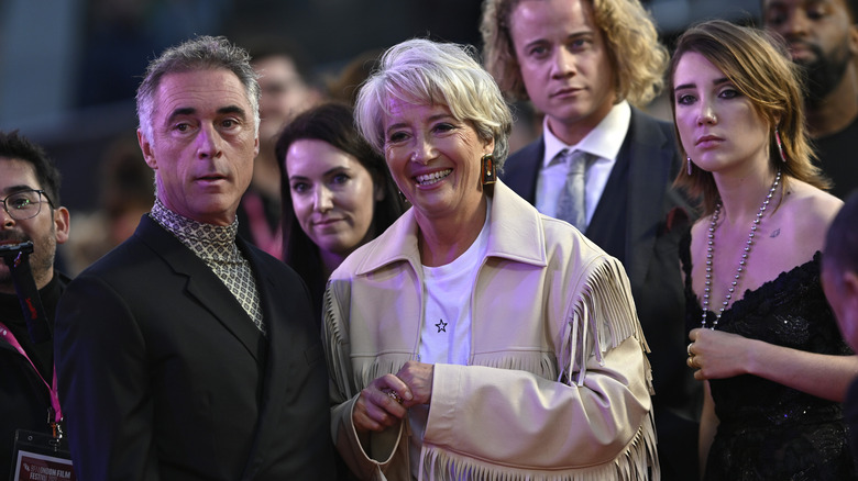 Greg Wise and Emma Thompson watch something