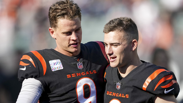 Joe Burrow kisses Evan McPherson to celebrate game-winning field goal