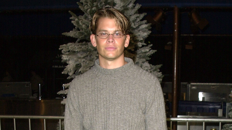 Eric Christian Olsen smiling wearing glasses