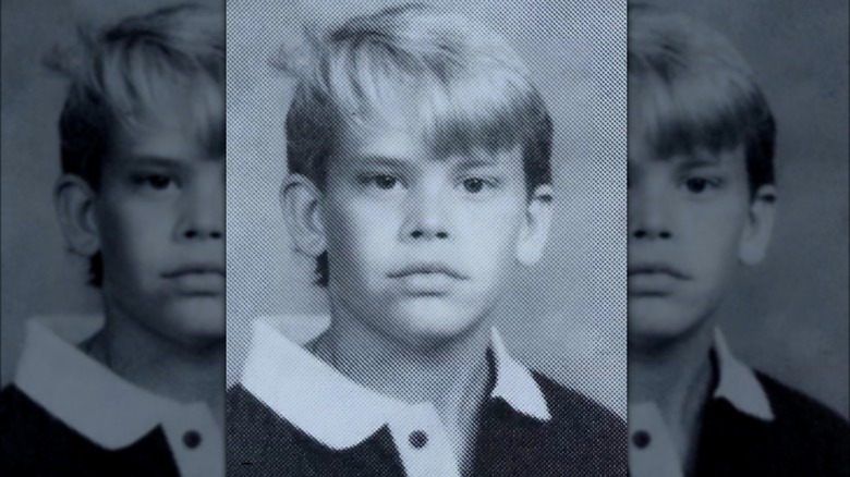 Eric Christian Olsen posing for school picture as a kid