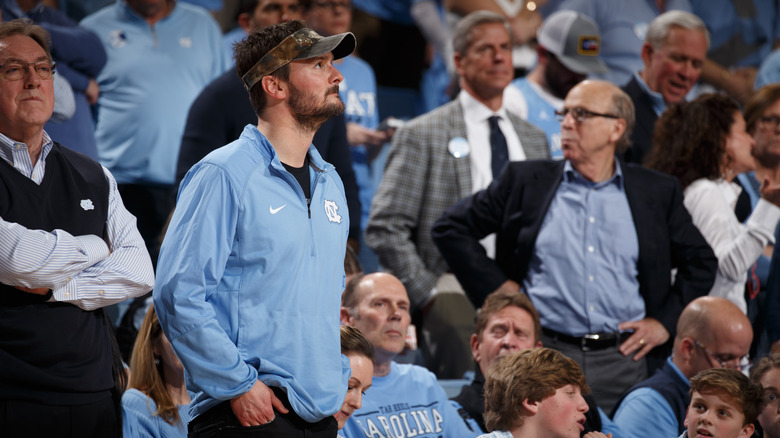 Eric Church watching game between the North Carolina Tar Heels and the Duke Blue Devils