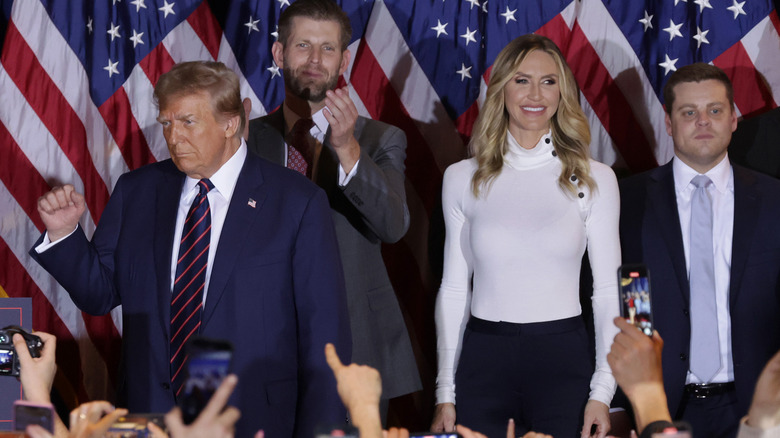 Donald, Eric, Lara Trump posing