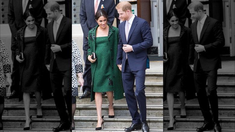 Meghan Markle and Prince Harry walking down steps outside