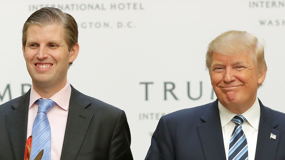 Eric Trump and Donald Trump pose together