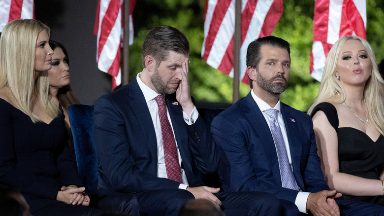 Eric Trump hand on face, Donald Trump Jr., Tiffany Trump, Ivanka Trump sitting