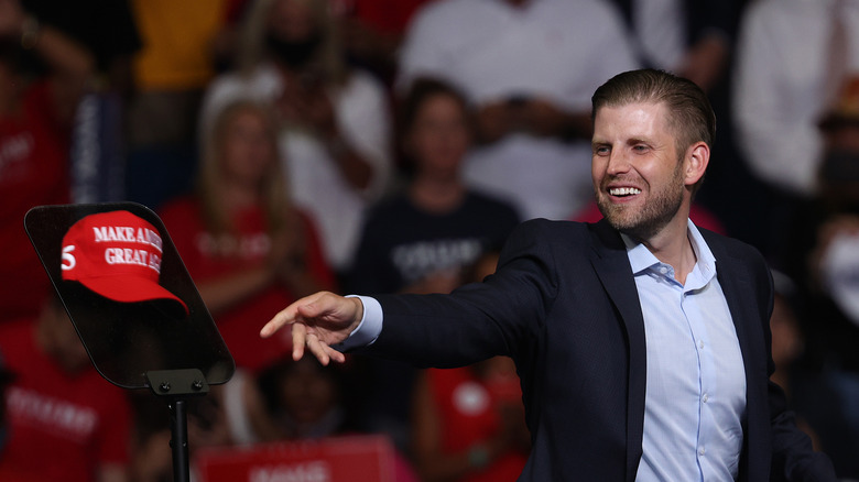 Eric Trump throwing hat