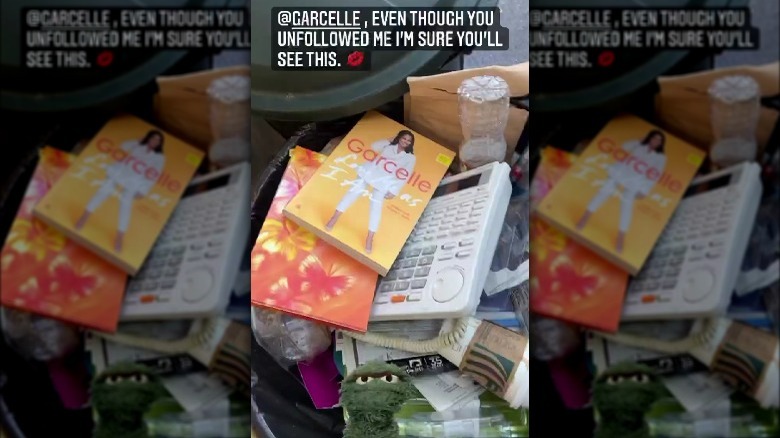 Erika Jayne's trash can containing Garcelle Beauvais' book