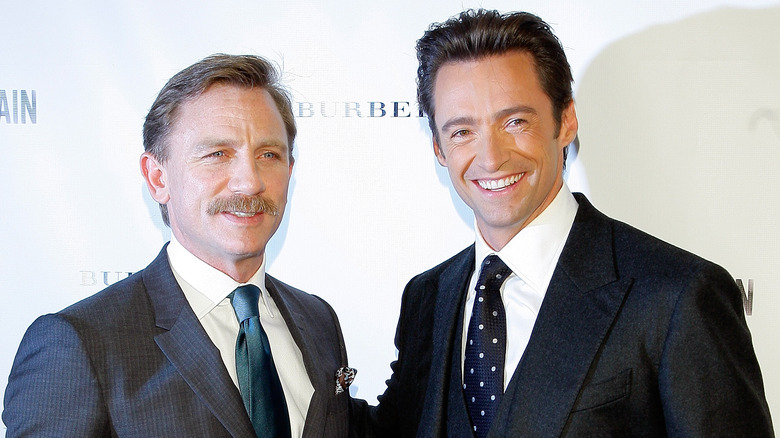 Daniel Craig and Hugh Jackman posing