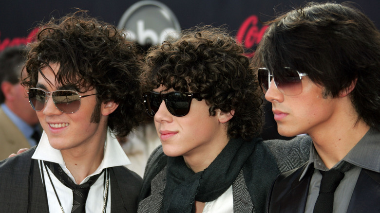 The Jonas Brothers wearing sunglasses