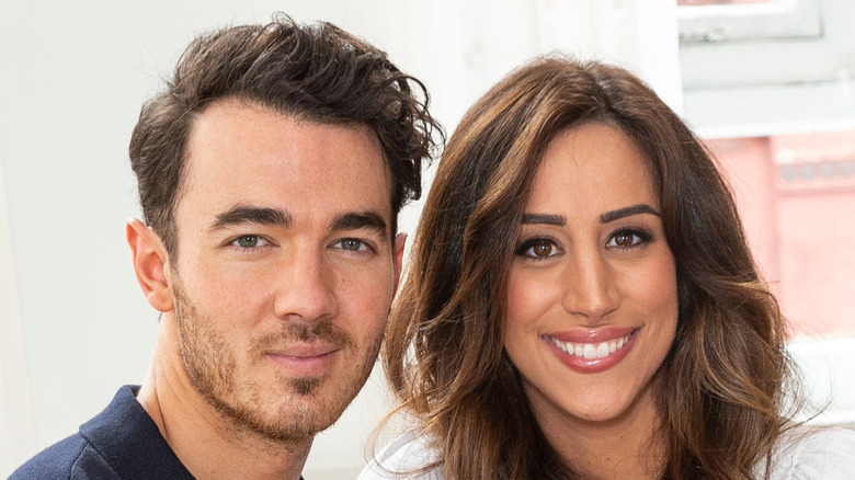 Kevin and Danielle Jonas posing