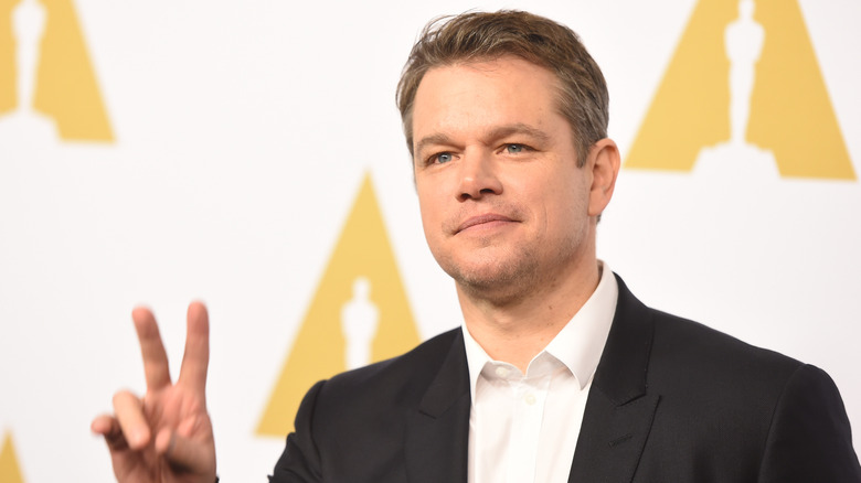 Matt Damon giving the peace sign