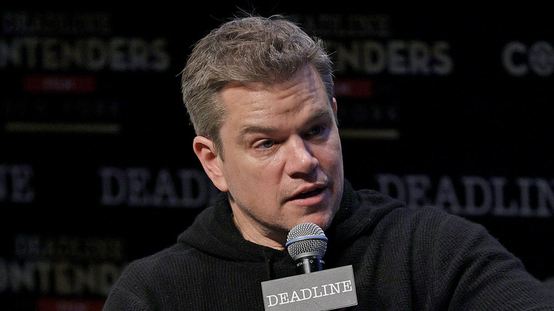 Matt Damon talking into a microphone