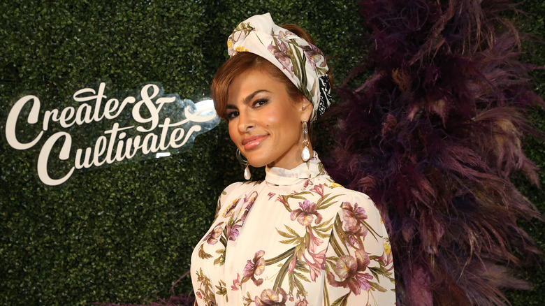 Eva Mendes smiles in floral dress at red carpet event