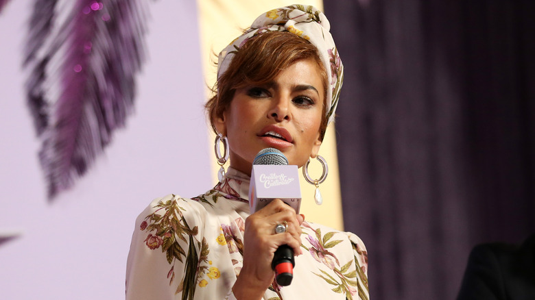 Eva Mendes speaking into microphone