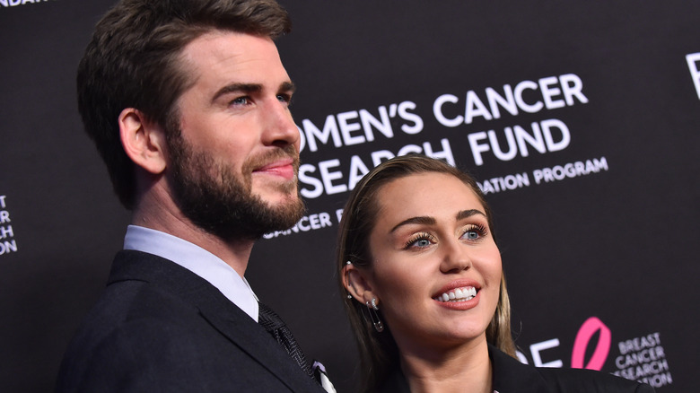 Miley Cyrus and Liam Hemsworth pose