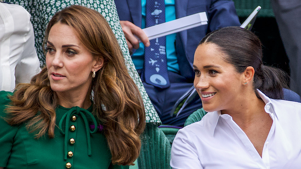 Kate Middleton and Meghan Markle watching tennis