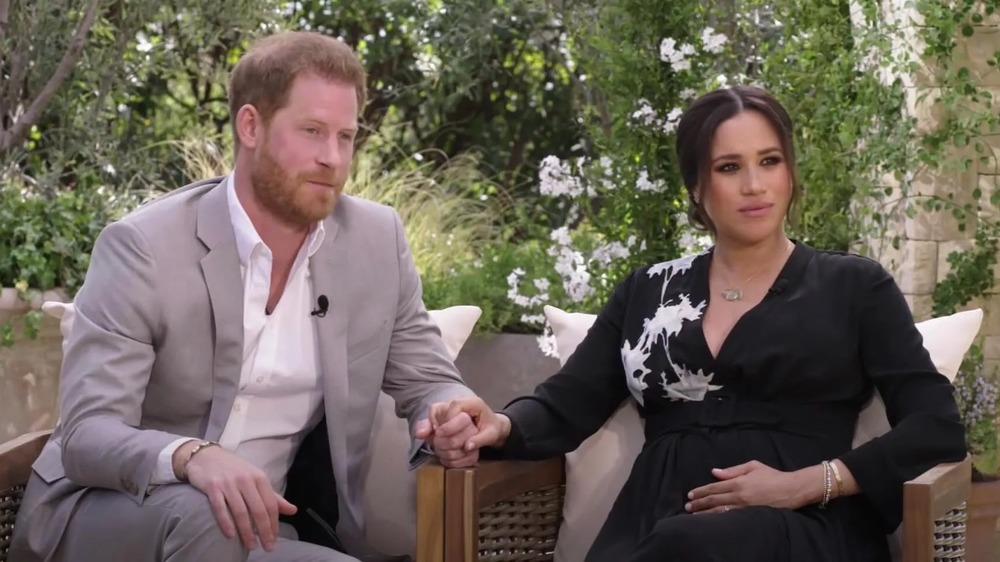 Prince Harry and Meghan Markle holding hands during their exclusive Oprah Winfrey interview 