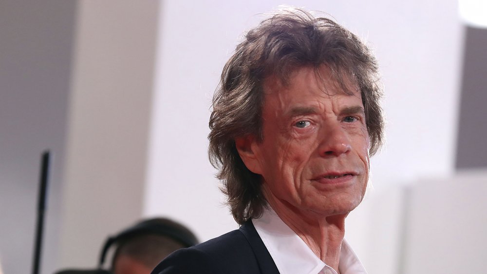 Mick Jagger turned to side, looking at camera
