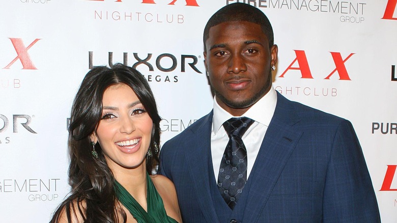 Kim Kardashian and Reggie Bush posing