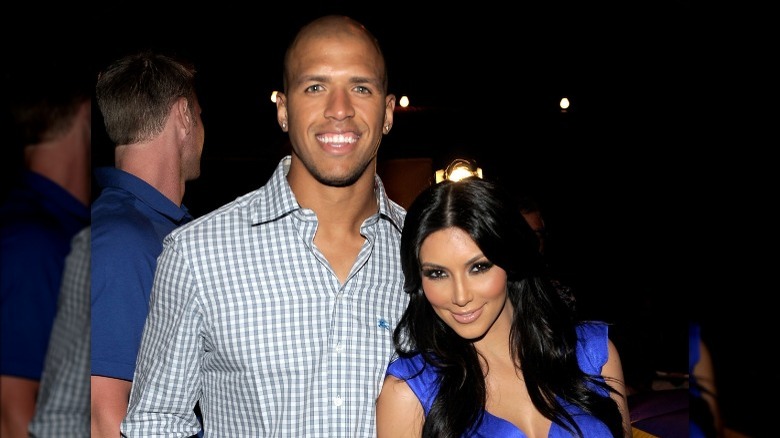 Miles Austin smiling with Kim Kardashian