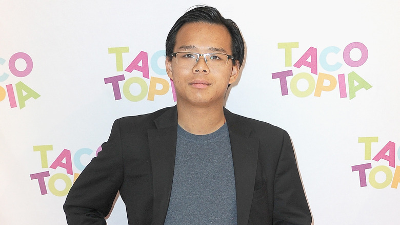 Harry Tsang, Lil Tay's former manager, posing