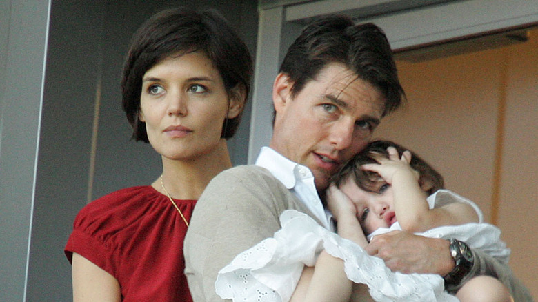 Katie Holmes short hair, Tom Cruise cradles Suri Cruise