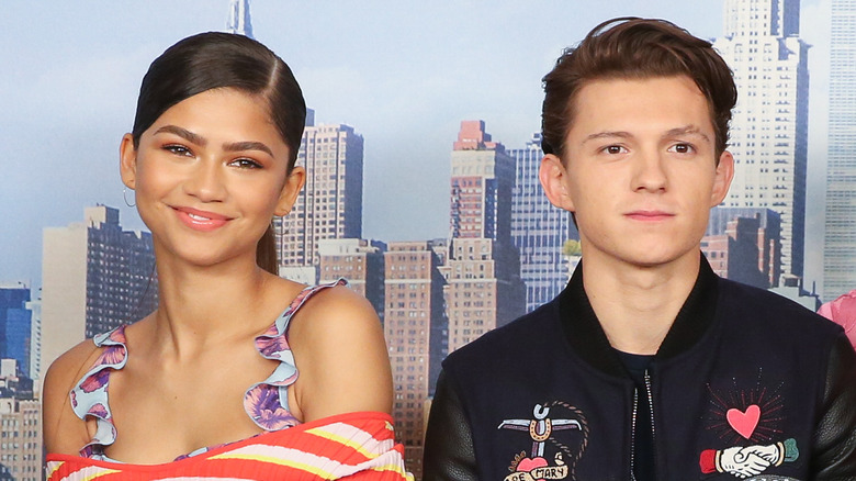 Zendaya and Tom Holland with wry smiles