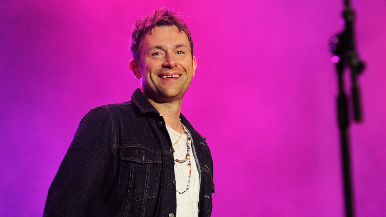 Damon Albarn performing, smiling