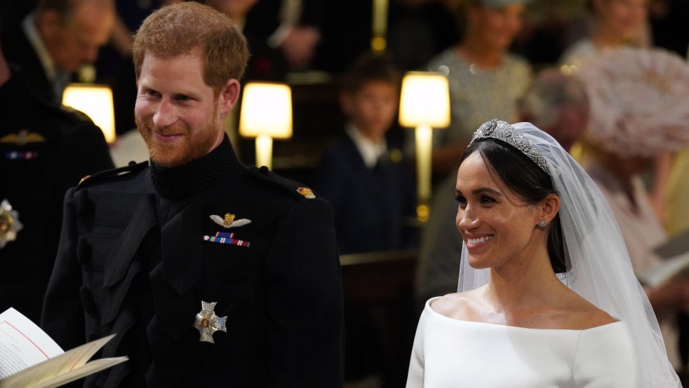 Prince Harry, Meghan Markle smiling during their wedding ceremony