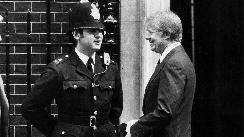 Jimmy Carter and a British policeman, chatting