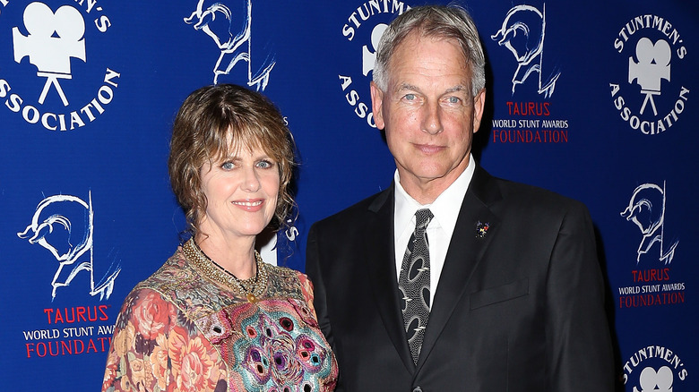 Pam Dawber and Mark Harmon smiling at an event