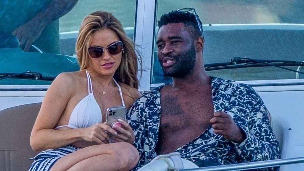 Chrishell Stause and Keo Motsepe on a boat 
