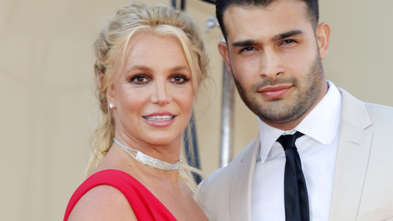 Britney Spears posing with Sam Asgheri