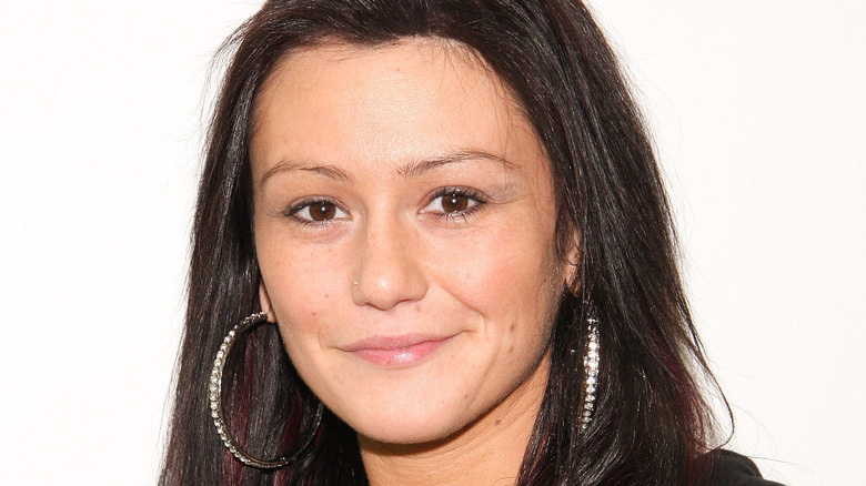 Jenni 'JWoww' Farley bare faced wearing large diamond hoop earrings