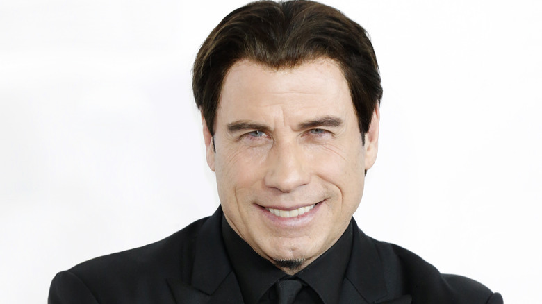 John Travolta posing in 2014