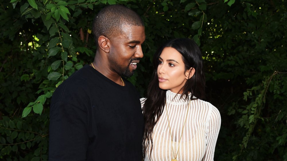 Kanye West, Kim Kardashian West looking at each other