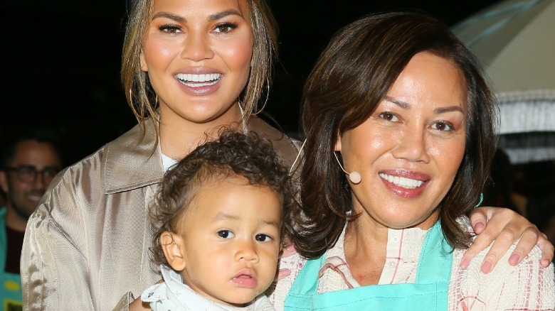 Chrissy Teigen, her mother, smiling with Teigen's son