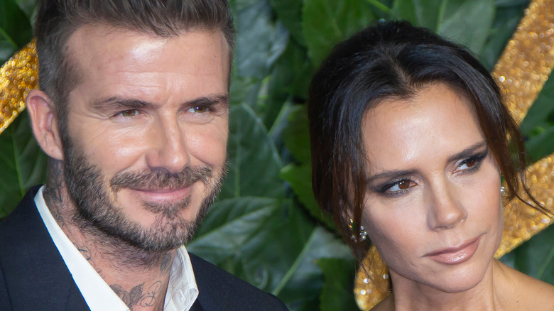 David and Victoria Beckham smiling