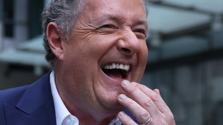 Piers Morgan with fingers near mouth