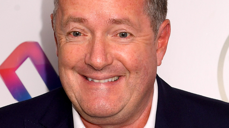 Piers Morgan with teeth on lip