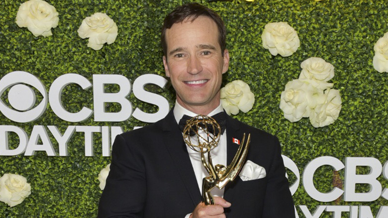 Mike Richards holding his Emmy, 2018