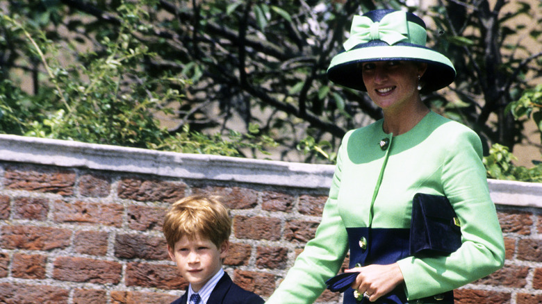 Prince Harry and Princess Diana walking