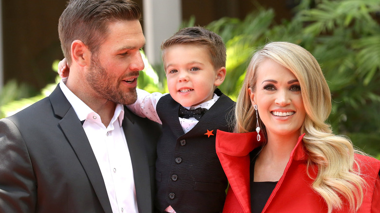 Mike Fisher, young Isaiah Fisher, and Carrie Underwood