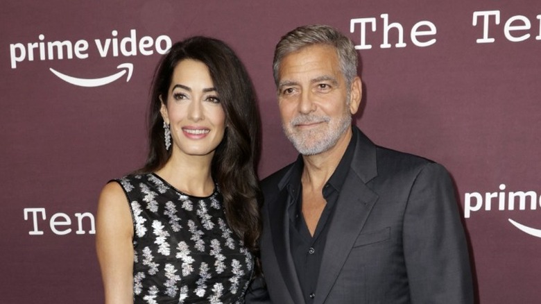 Amal Clooney George Clooney posing