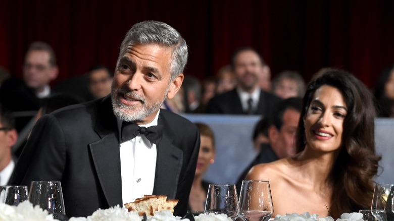 George Clooney and Amal Clooney at formal event